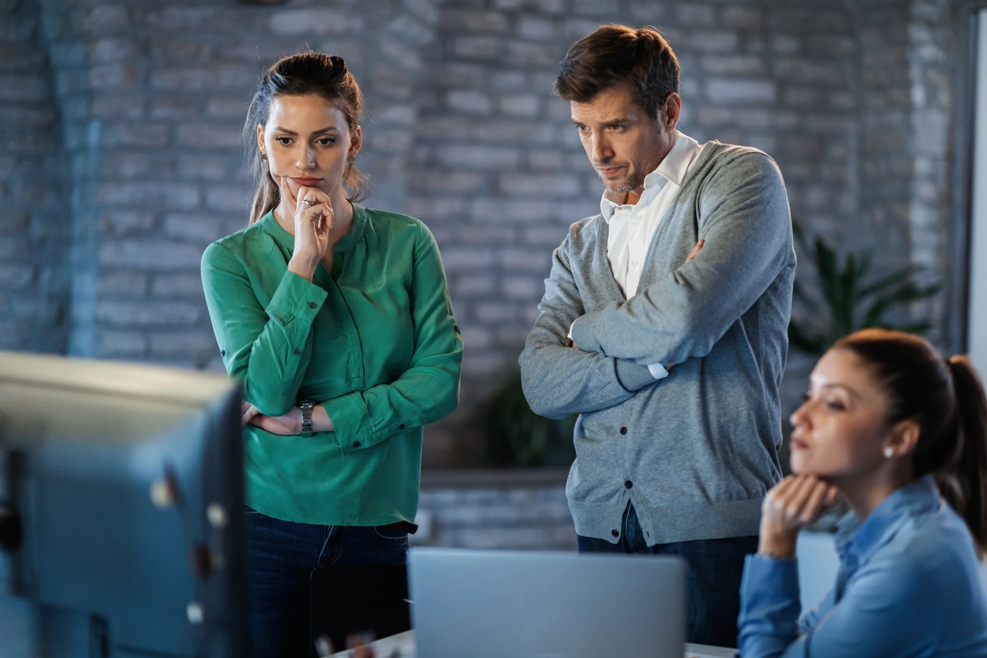 Three teammates brainstorming solutions to common web design problems.